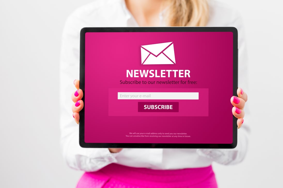 Woman Showing Tablet with Newsletter Signup Page